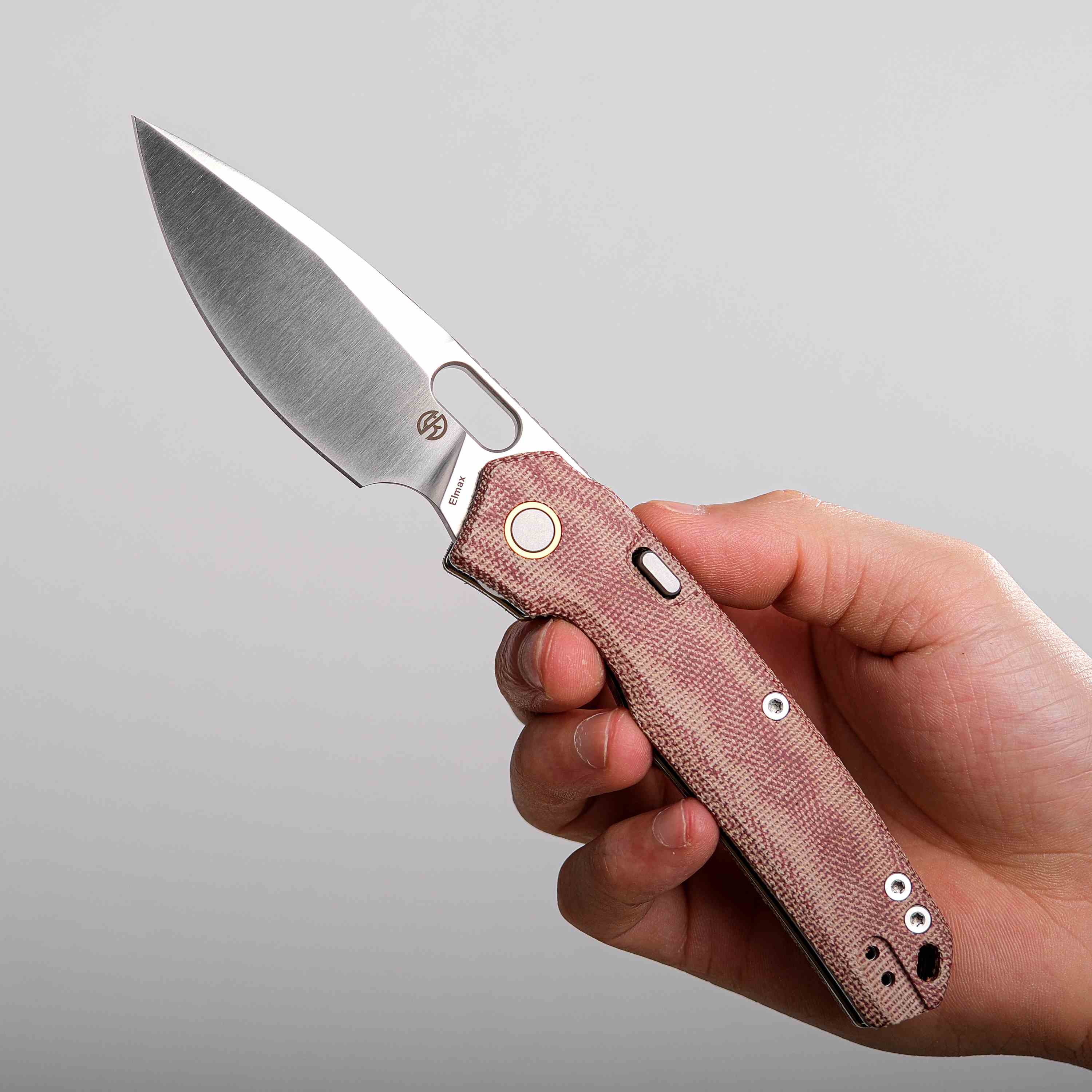 Vosteed Psyop knife held in hand, Elmax blade