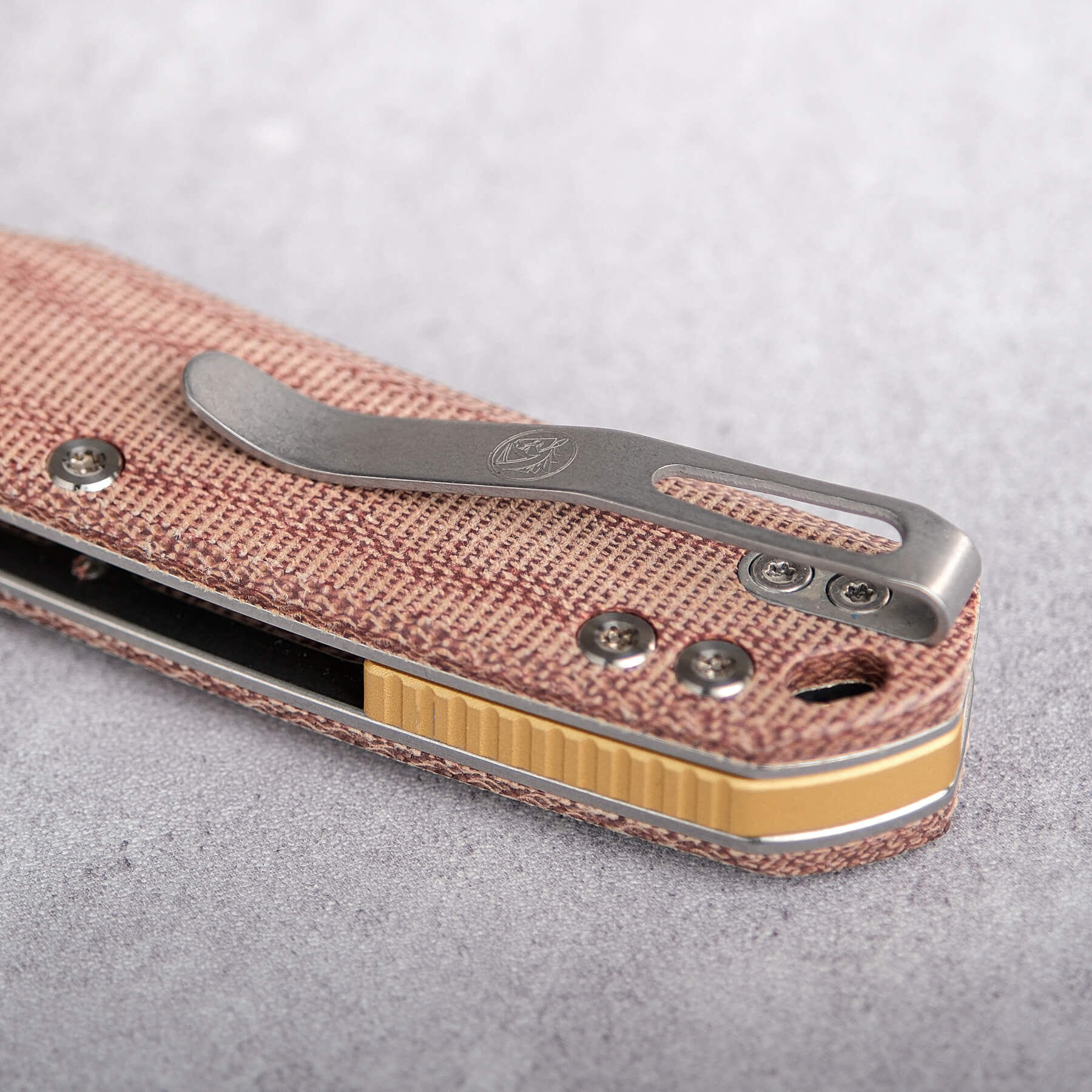 Vosteed Psyop knife detail: Micarta handle and pocket clip
