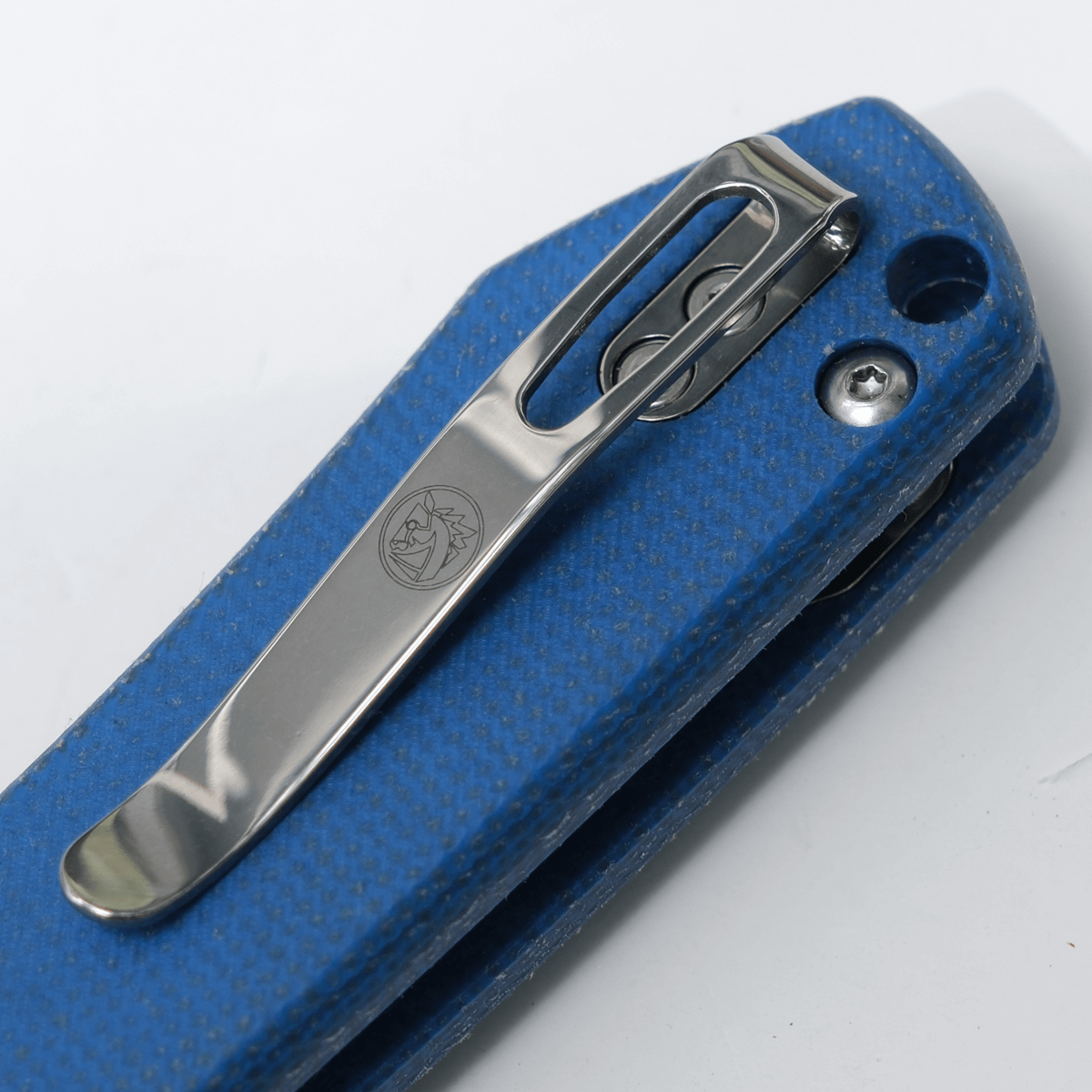 Vosteed Raccoon knife pocket clip detail, blue Micarta handle