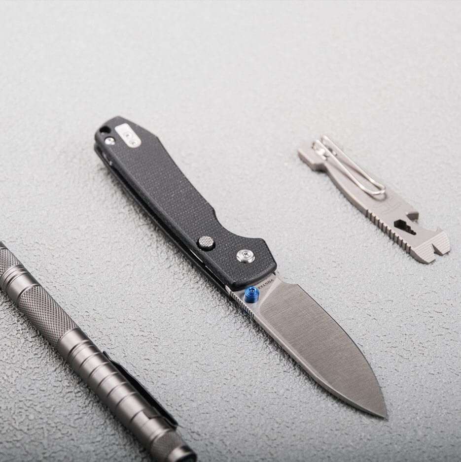 Vosteed Raccoon knife, EDC essentials, tool, grey background