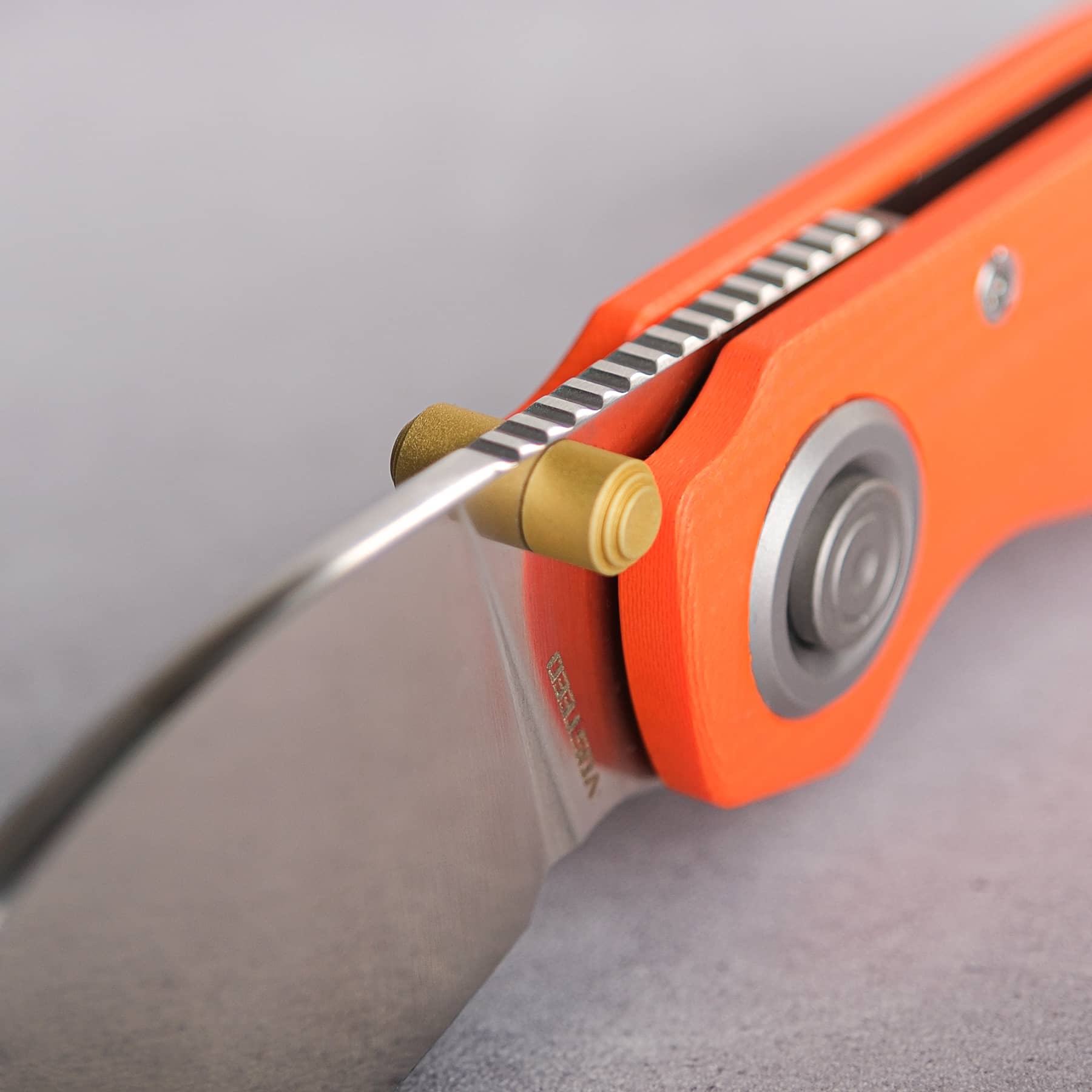 Vosteed Shilin Cutter® knife blade detail with orange handle