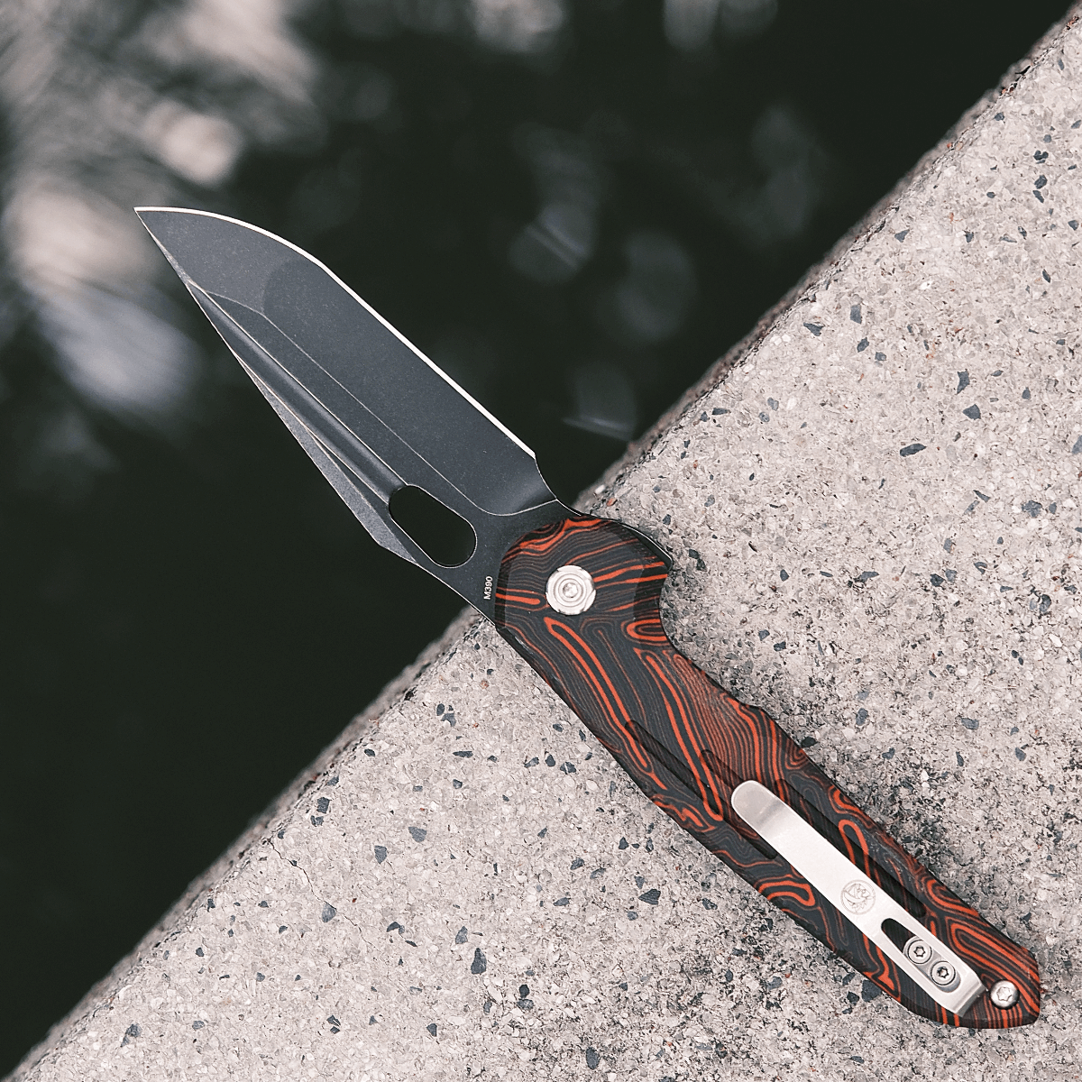 Vosteed Thunderbird Trek Lock knife on concrete, M390 Blade