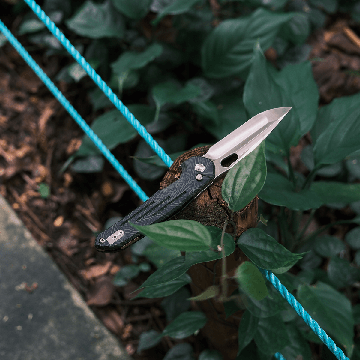 Vosteed Thunderbird Trek Lock Knife resting on wood, M390 blade