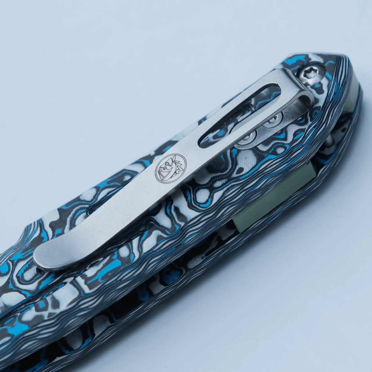 Vosteed Thunderbird knife pocket clip detail, cloud carbon fiber handle