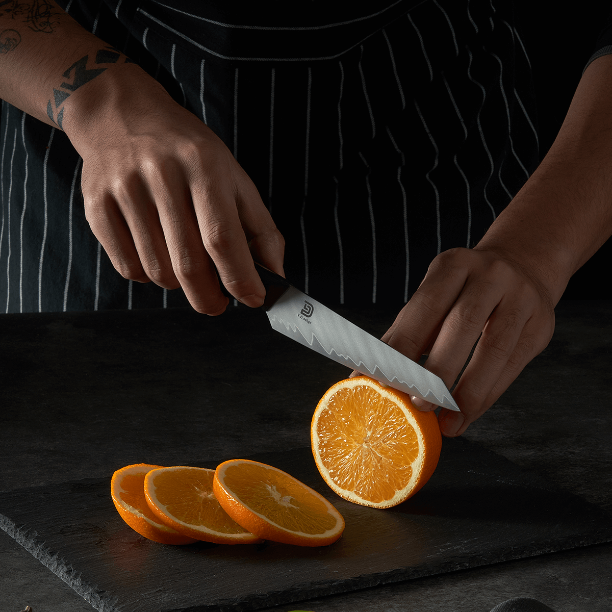 Vosteed Morgan Utility Knife slicing an orange