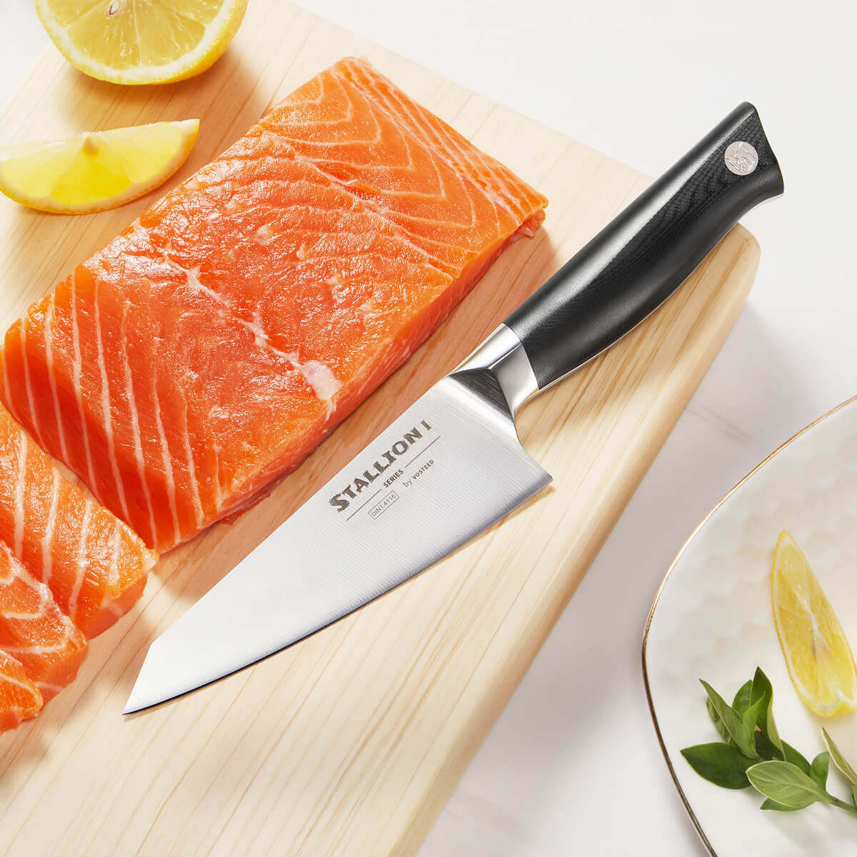 Stallion I boning knife cutting salmon on a wooden board