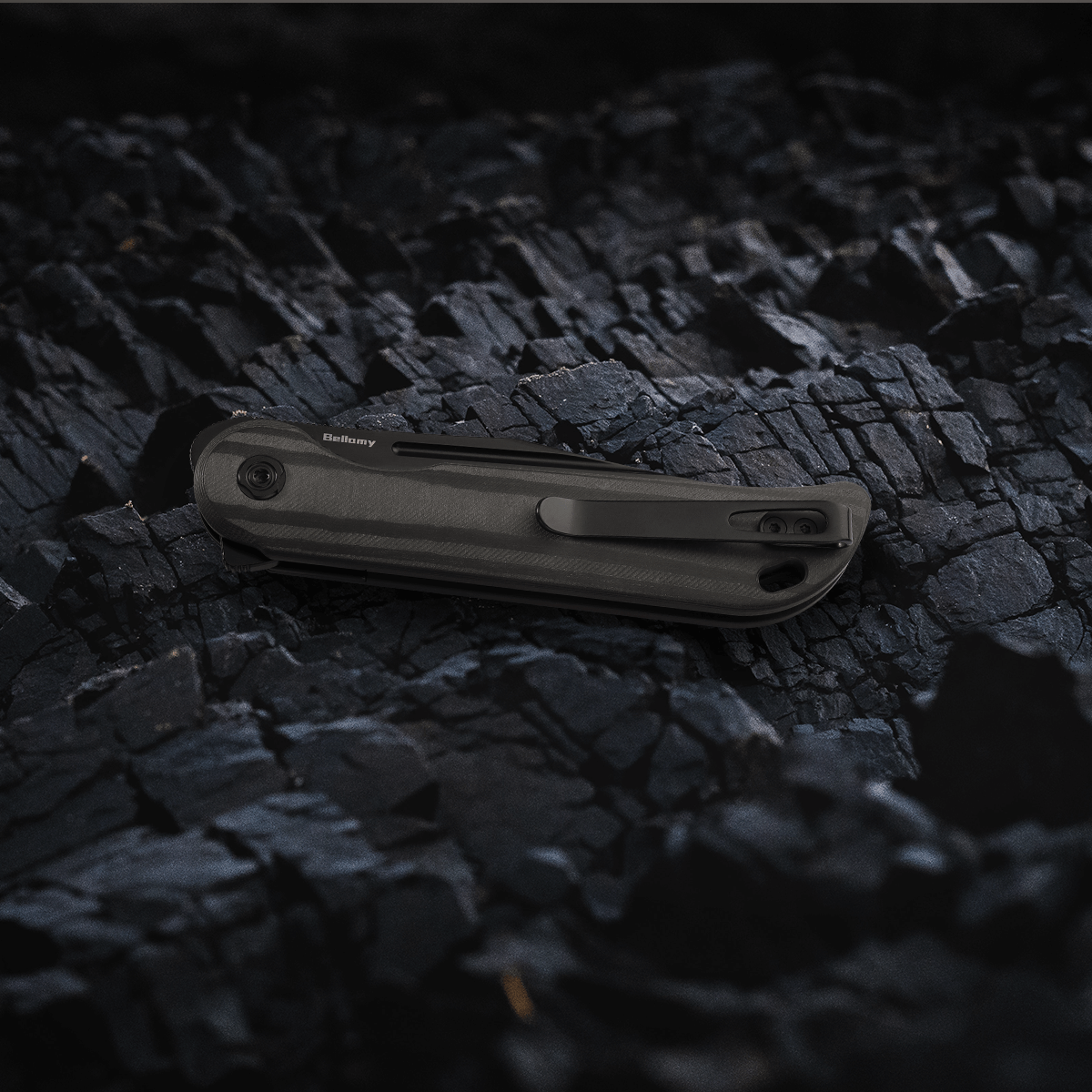 Vosteed Bellamy EDC knife on dark rock background Vosteed Bellamy(Midnight Black)#color_Midnight-Black
