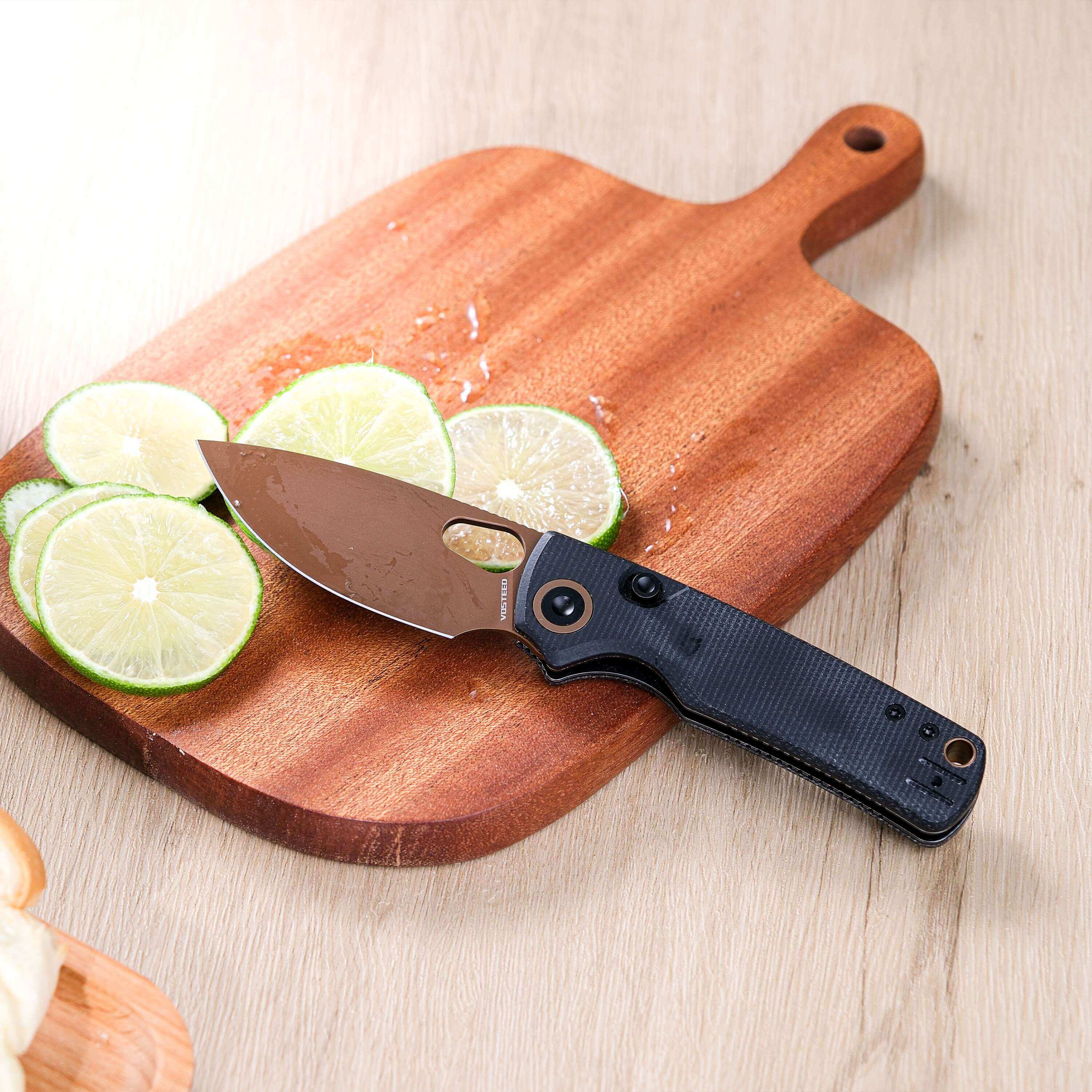 Vosteed Porcupine knife slicing lime on a cutting board