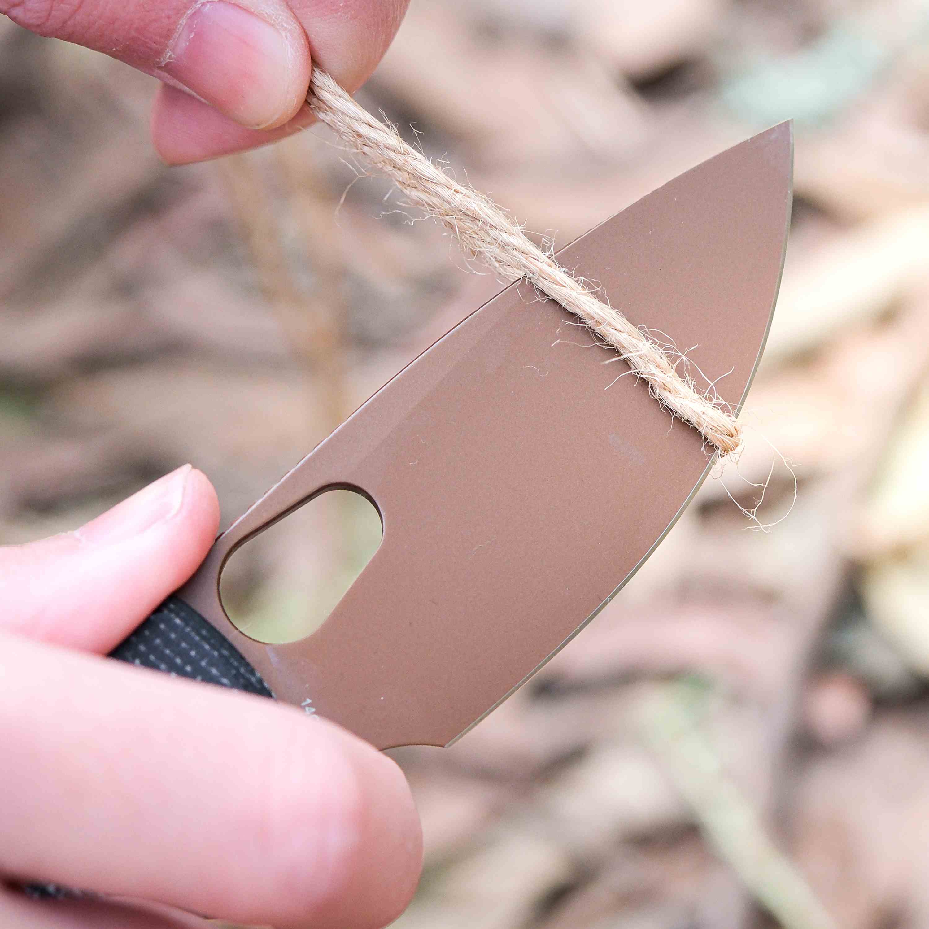 Vosteed Porcupine knife cutting rope, showing blade sharpness