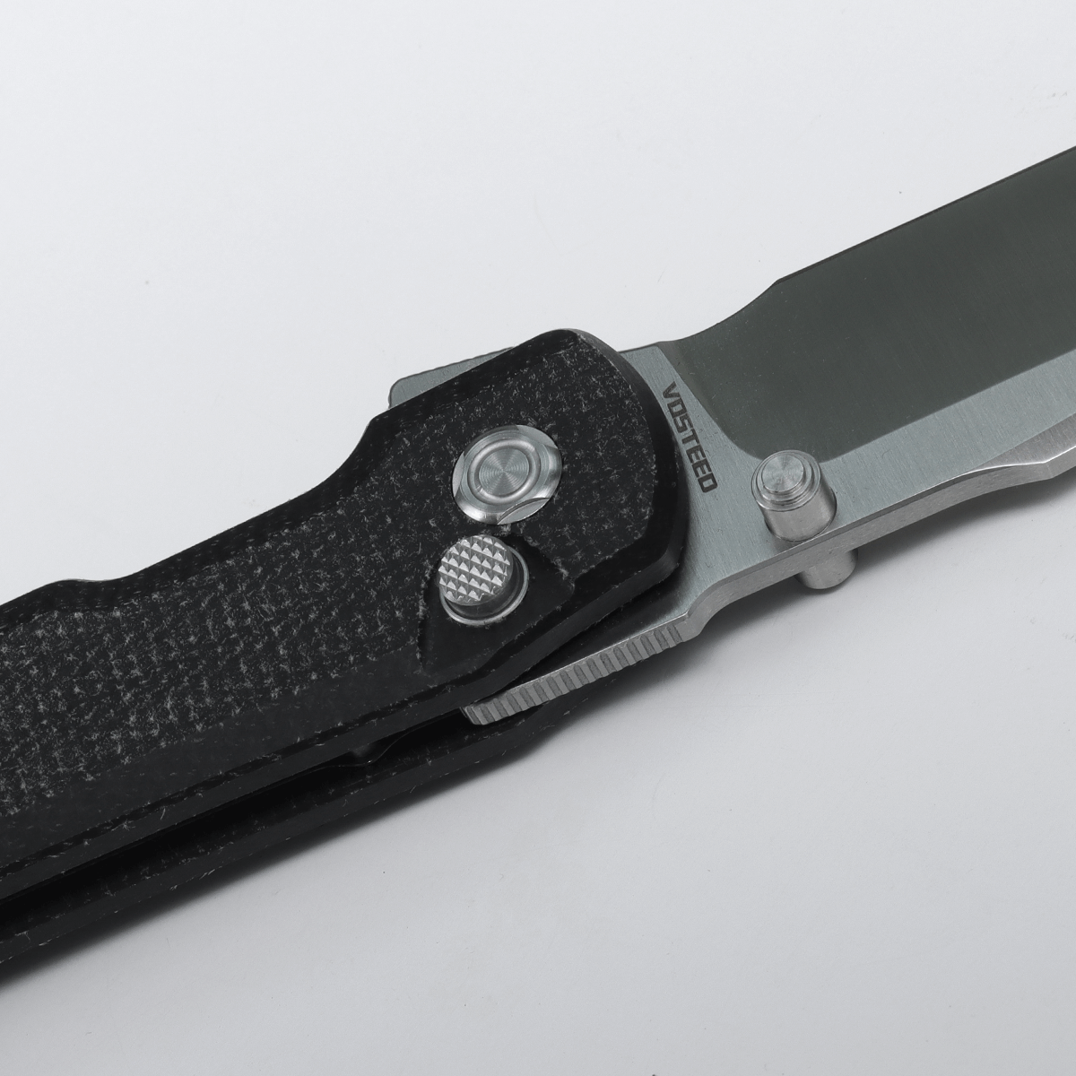 Vosteed Valkyrie knife detail with thumb stud and blade