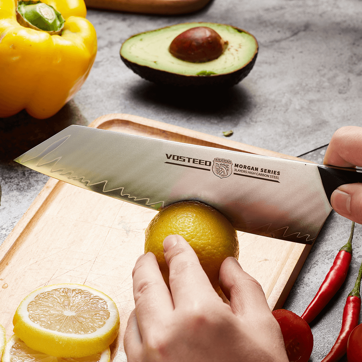 Vosteed Morgan Santoku knife cutting lemon
